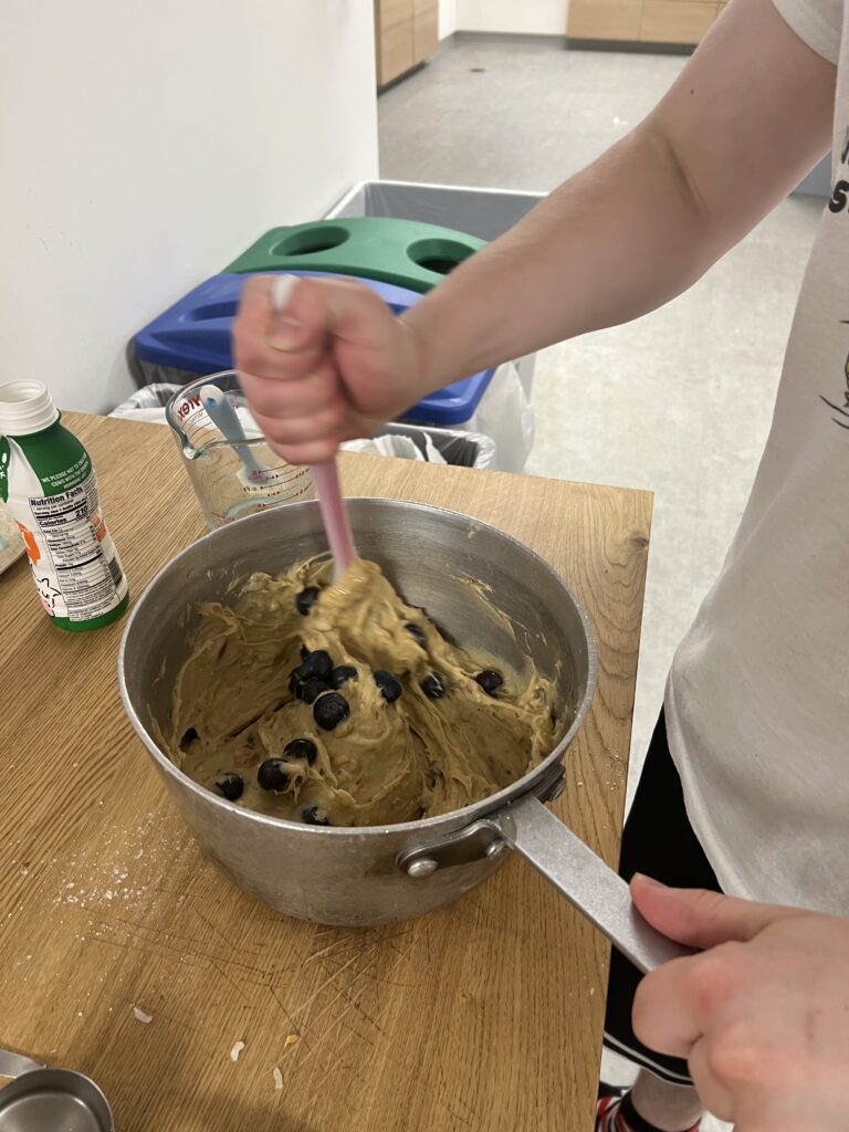 Mixing blueberry’s into pancake mix 
